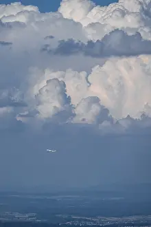 Dramatic Clouds Europe Stampe: Plane in front of dramatic clouds, Switzerland