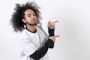 Self Confident Male Model Stampe: Pointing to the right at a copy paste space
