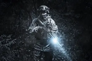 Military Operations Stampe: Portrait of a commando in the forest
