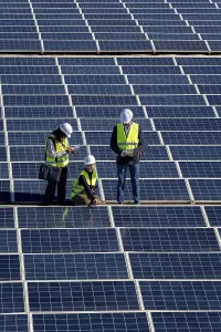Solar Panel Inspection Stampe: Engineers are inspecting a large solar panel array