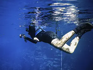 Female Scuba Diver Stampe: Practicing diving and snorkeling