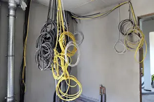 Professional Electrical Installation Stampe: Professional electrical installation on a building shell