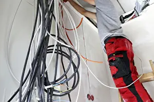 Electrical Installation Stampe: Professional electrical installation on a building shell