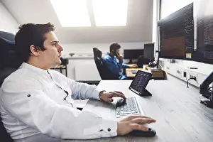 Computer Specialist Stampe: IT Programmer Working on Desktop Computer