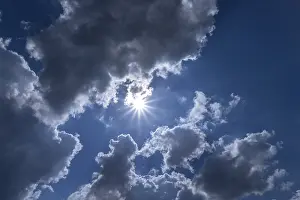 Germany Cloudy Sky Stampe: Rain clouds with sun in backlight