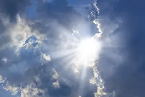 Sunbeams Through Clouds Stampe: Rain clouds with sun shining through