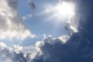 Sun Shining Through Clouds Stampe: Rain clouds with sun shining through
