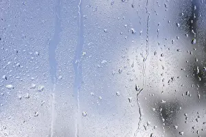 Raindrops On Window Stampe: Rain drops on window as the clouds clear behind