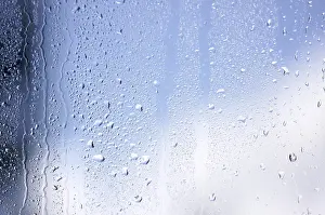 Cloudy Sky With Raindrops Stampe: Rain drops on window as the clouds clear behind