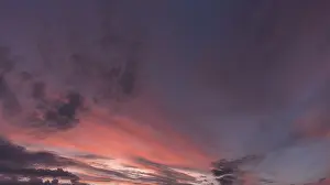 Overcast Cloudy Skies Europe Stampe: Reddish clouds in the evening sky