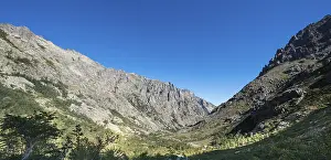 Mountainous France Stampe: Restonica river flows at its source through mountain valley