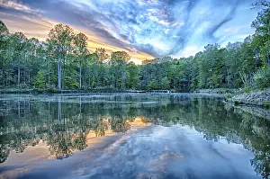 Uninhabited Cloudy Skies Stampe: River reflection of clouds over wide angle