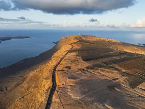 Evening Light On Coast Stampe: Road on cliffs in evening light