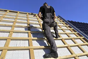 Traditional Craftsman At Work Stampe: Roofer or carpenter at work