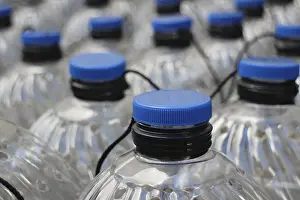 Environmental Issue Plastics Stampe: Rows translucent plastic bottles close to