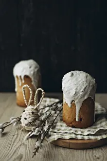 Traditional Easter Dessert Stampe: A rustic setup featuring two Kulich