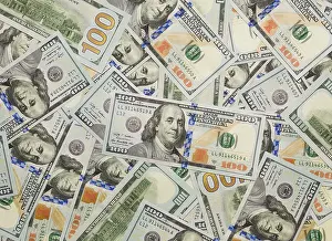 Newly Designed Dollar Bills Stampe: Several scattered layer of the newly designed U