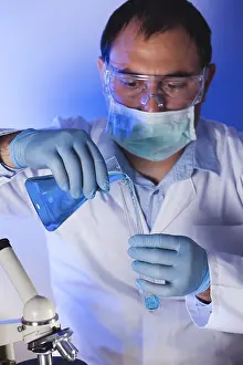 Test Tube Analysis Stampe: Scientist is doing research at the work