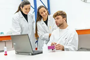 Healthcare System Information Stampe: Scientist team using laptop to analysis data of a research study