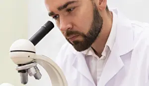 One Person Lab Stampe: Scientist is using microscope in a laboratory during research work