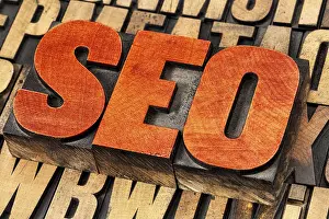 Vintage Letterpress Typography Stampe: SEO (search engine optimization) acronym - word abstract in vintage letterpress wood type stained by red ink