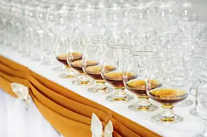 Whisky And Liquor Display Stampe: Set of brandy glasses at buffet table