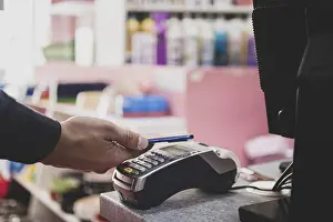 Online Shopping Payment Stampe: Shopper does payment using smartphone