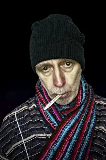 Dark Background Images Stampe: Sick man with the flu and temperature