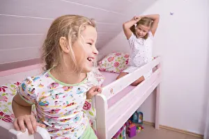 European Childhood Scene Stampe: Two sisters in bed, getting up