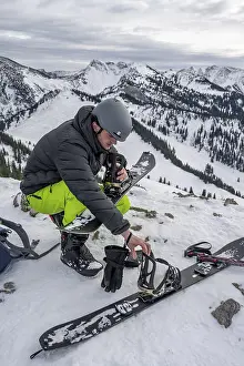 Ski Touring In Germany Stampe: Ski tourers, man assembles his splitboard