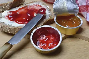 Basic Food Still Life Images Stampe: Slice of bread with jam and jam in portion pack