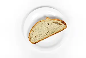 Food Studio Shot Stampe: A slice of bread on a plate
