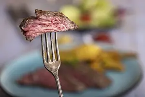 Deserted Table Meal Stampe: Slice of steak on a fork