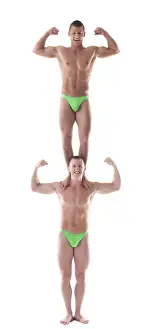 Circus Artist Training Stampe: Two smiling force acrobat posing in studio