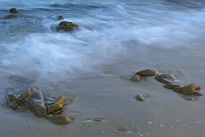 European Beaches Stampe: Soft waves breaking on a beach