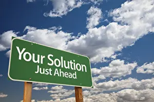 Symbolic Picture Success Stampe: Your solution green road sign over dramatic clouds and sky