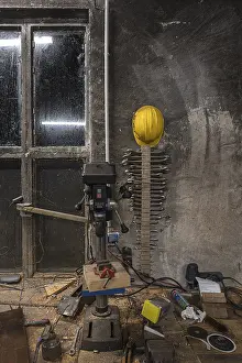 Northern Germany Scenes Stampe: Spanner and construction helmet on the wall of a workshop