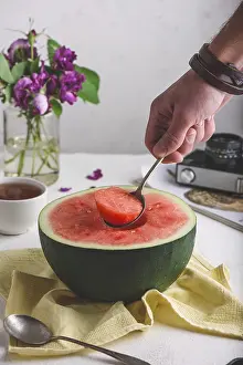 Watermelon Slice Stampe: The Spoon with Piece of Watermelon in Man Hand