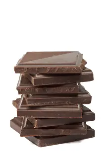 Close Up Shot Stampe: Stack of dark chocolate isolated on white