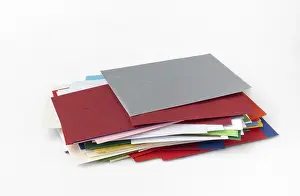 Colorful Stationery Stampe: Stack of different coloured envelopes