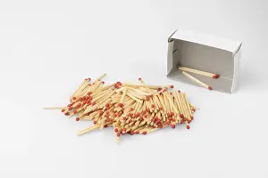 Bright White Background Stampe: Stack of matches in front of almost empty box
