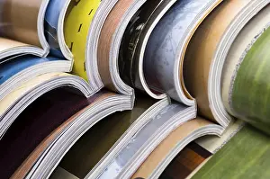 Deserted Library Stampe: Stack of open magazines