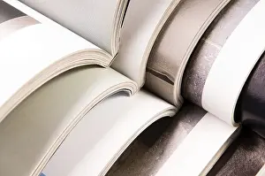 Waste Separation Techniques Stampe: Stack of open magazines