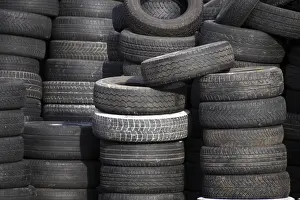 Plastic Waste Disposal Stampe: Stack of used tyres