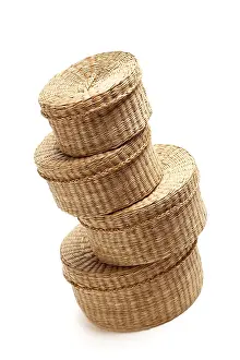 White Studio Backdrop Stampe: Stack of various sized wicker baskets isolated on white