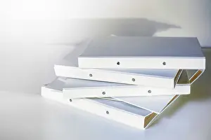 Desk Organization Ideas Stampe: Stack of white file folder or ring binder waiting to be processed in an office