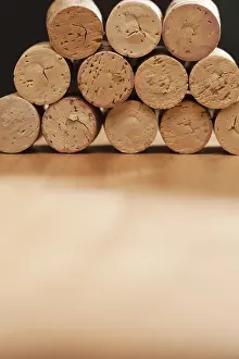 Uninhabited Winery Scene Stampe: Stack of wine corks on a wood surface