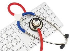 Healthcare System Concept Image Stampe: Stethoscope and keyboard of a computer