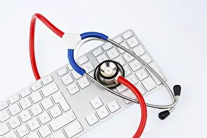 Austria Healthcare System Stampe: Stethoscope and keyboard of a computer