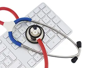 Symbolic Healthcare Image Stampe: Stethoscope and keyboard of a computer